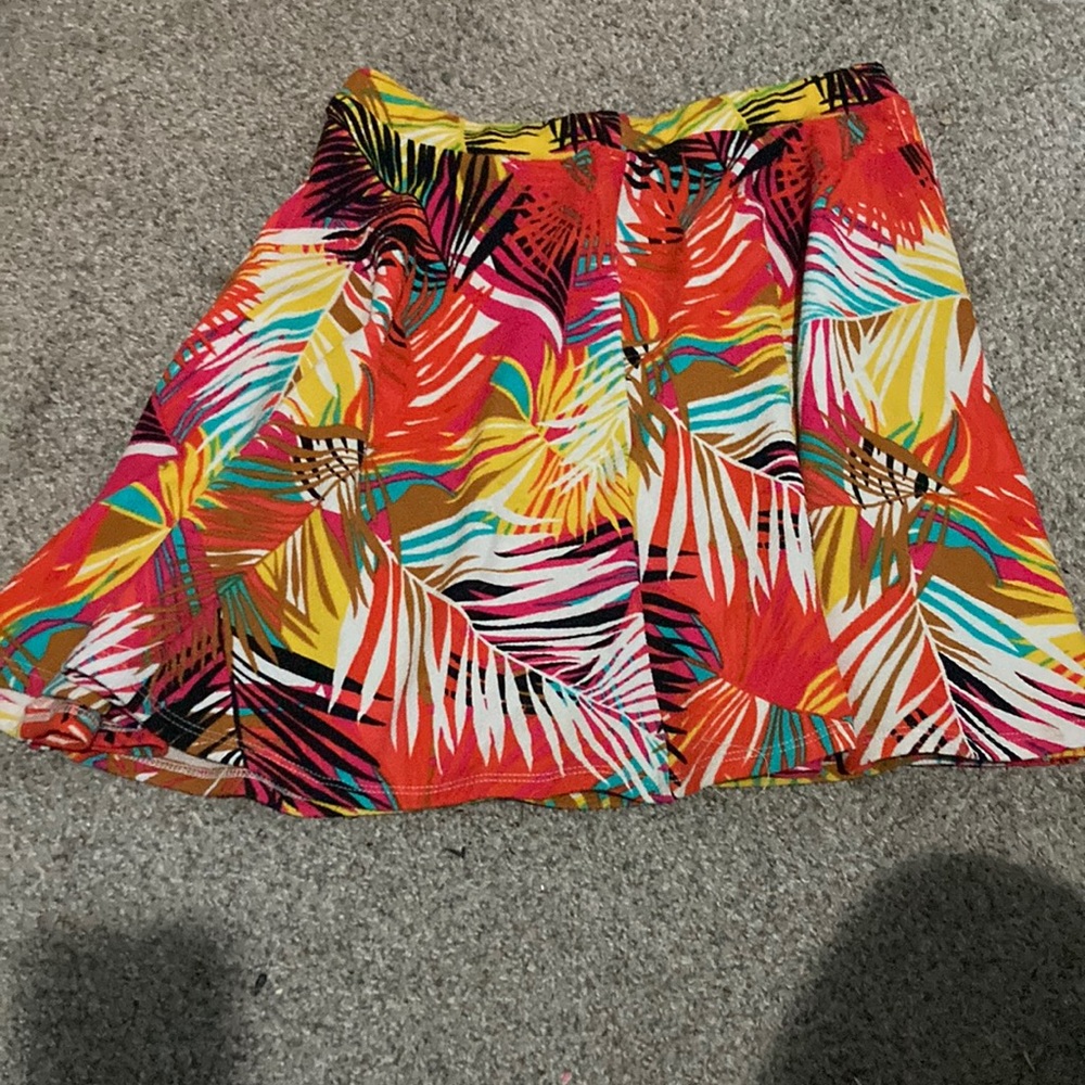 Stretch waist mini skirt. Tropical print, fit and flare.